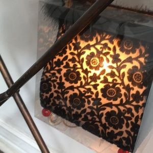 Purse shaped accent lamp. Black with feather top